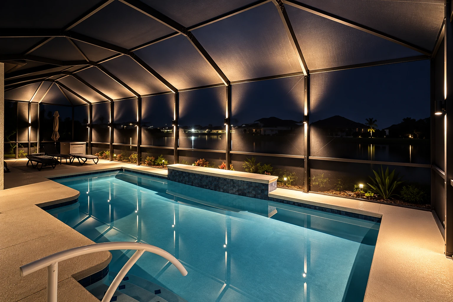 Screened patio enclosure around a lit swimming pool, with dark mesh walls and a peaked frame at night.